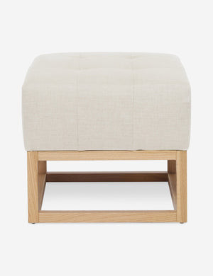 Natural Linen Grasmere Ottoman with an upholstered cushion and airy wooden frame by Ginny Macdonald