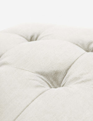 Button tufting on the cushion of the Oyster White Linen Grasmere Ottoman