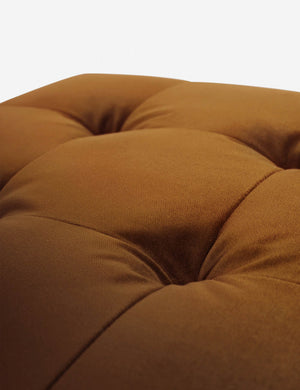 Button tufting on the cushion of the Cognac Velvet Grasmere Ottoman