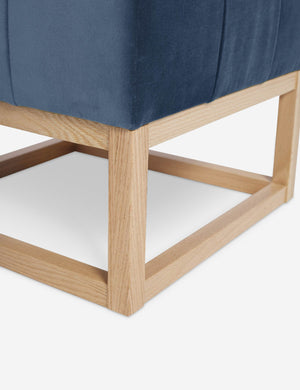 Close up of the airy wooden frame on the bottom of the Grasmere Harbor Blue Velvet Ottoman
