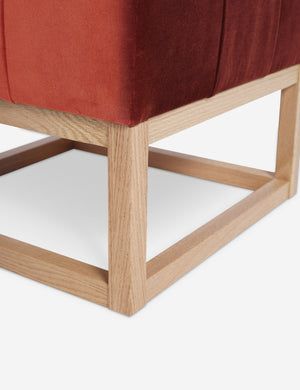 Close up of the airy wooden frame on the bottom of the Grasmere Paprika Velvet Ottoman