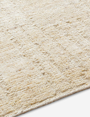 Close up angled view of the Malone textured ivory hand-knotted wool runner rug