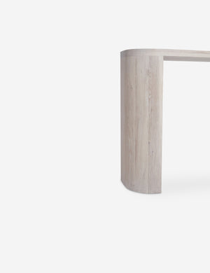 Close-up of the leg of the Luna white-washed oak oval console table.