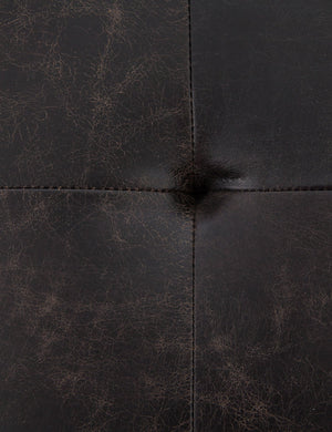 The tufted finish of the Olwina Square Leather Coffee Table