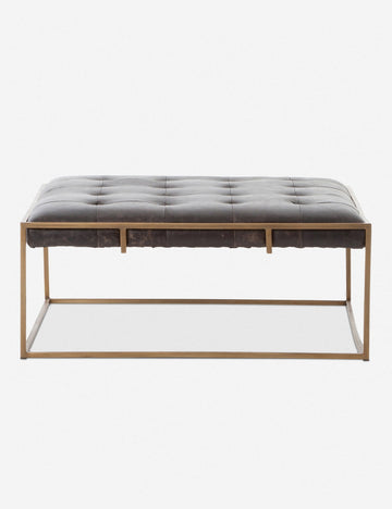 | Olwina Square Black Leather Coffee Table with a tufted finish and a brass-tone metal frame