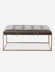 | Olwina Square Black Leather Coffee Table with a tufted finish and a brass-tone metal frame
