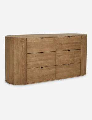 Angled view of the Kono 6-drawer curved oak wide dresser.