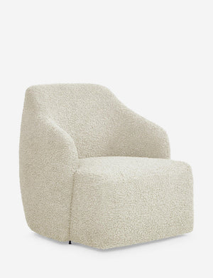 Angled view of the Tobi cream boucle swivel chair