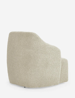 Angled rear view of the Tobi cream boucle swivel chair