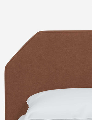 The geometric headboard on the Kipp Terracotta Linen platform bed