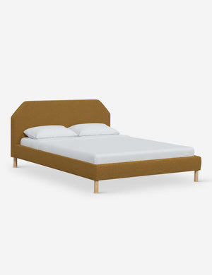 Angled view of the Kipp Ochre Boucle platform bed
