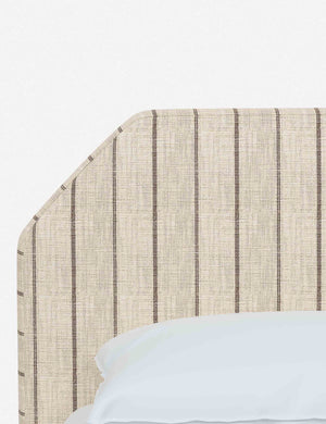 The geometric headboard on the Kipp natural stripe linen platform bed