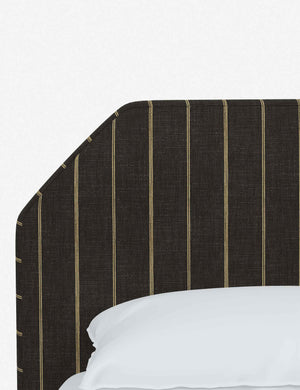 The geometric headboard on the Kipp Peppercorn Stripe Linen platform bed