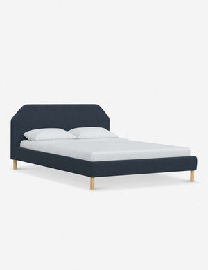 Angled view of the Kipp Navy Linen platform bed