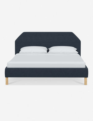 Kipp Navy Linen upholstered platform bed with a geometric headboard and pinewood legs