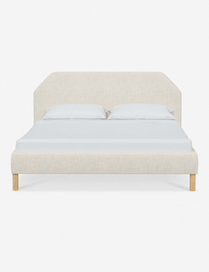 Kipp Talc Linen upholstered platform bed with a geometric headboard and pinewood legs