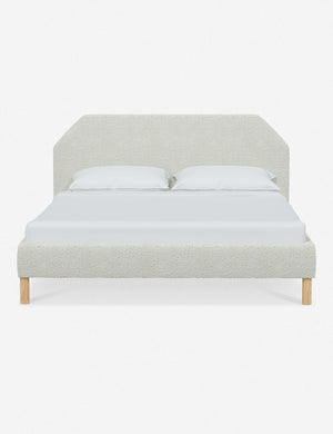 Kipp White Boucle upholstered platform bed with a geometric headboard and pinewood legs