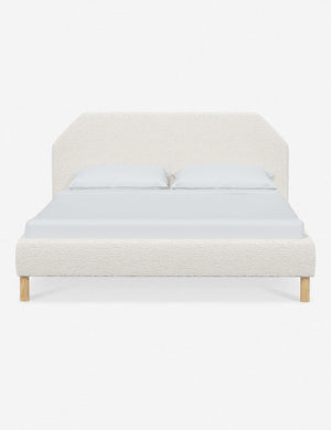 Kipp Cream Sherpa upholstered platform bed with a geometric headboard and pinewood legs