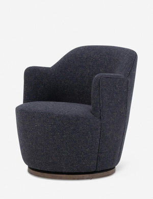 Angled side view of Margie rounded barrel swivel accent chair in slate