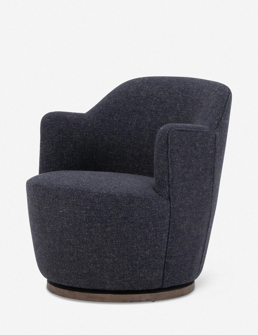 #color::slate | Angled side view of Margie rounded barrel swivel accent chair in slate