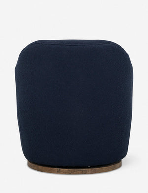Rear view of Margie rounded barrel swivel accent chair in navy