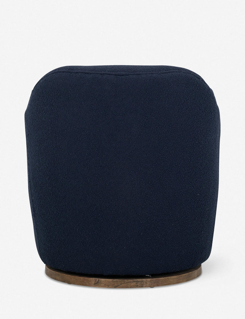 #color::navy | Rear view of Margie rounded barrel swivel accent chair in navy
