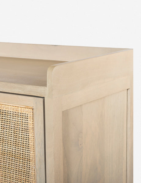#color::natural | Close-up of the walled exterior surface of the Philene natural mango wood sideboard with cane doors