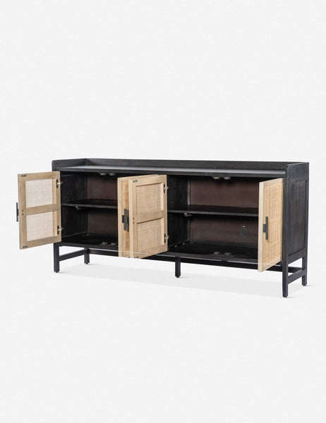#color::black | Angled view of the Philene black mango wood sideboard with cane doors with all four doors open, revealing its inner shelving