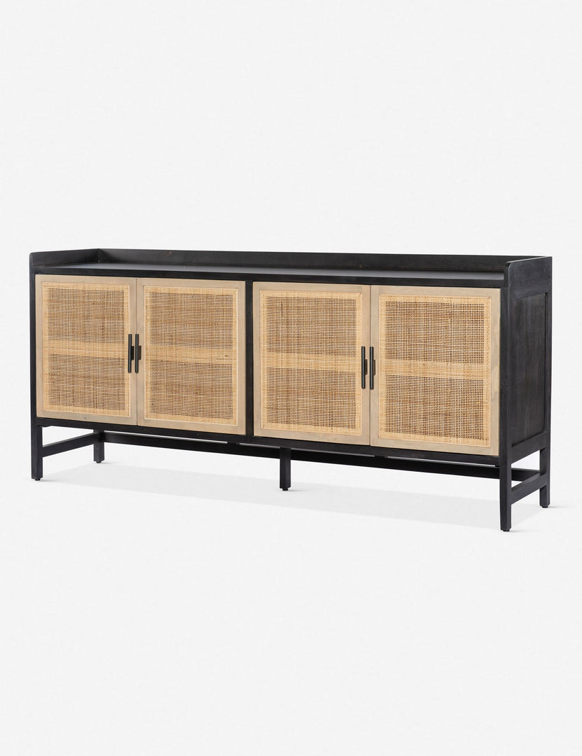 #color::black | Angled view of the Philene black mango wood sideboard with cane doors