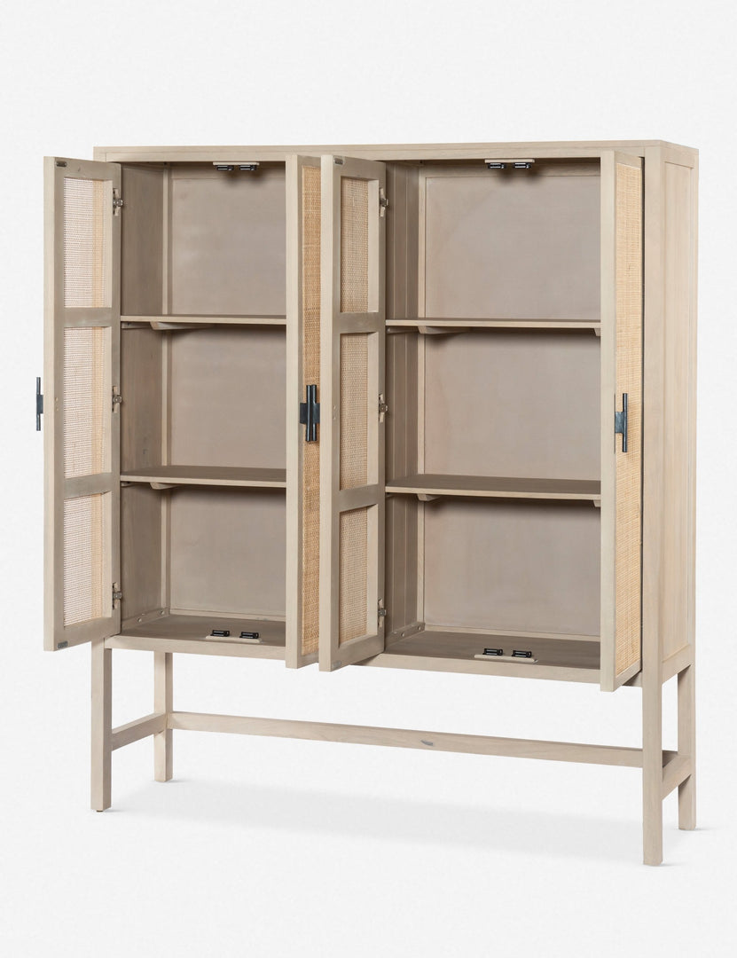 #color::natural | Angled view of the Hannah whitewashed mango wood cabinet with cane doors with all four doors open revealing its inner shelving