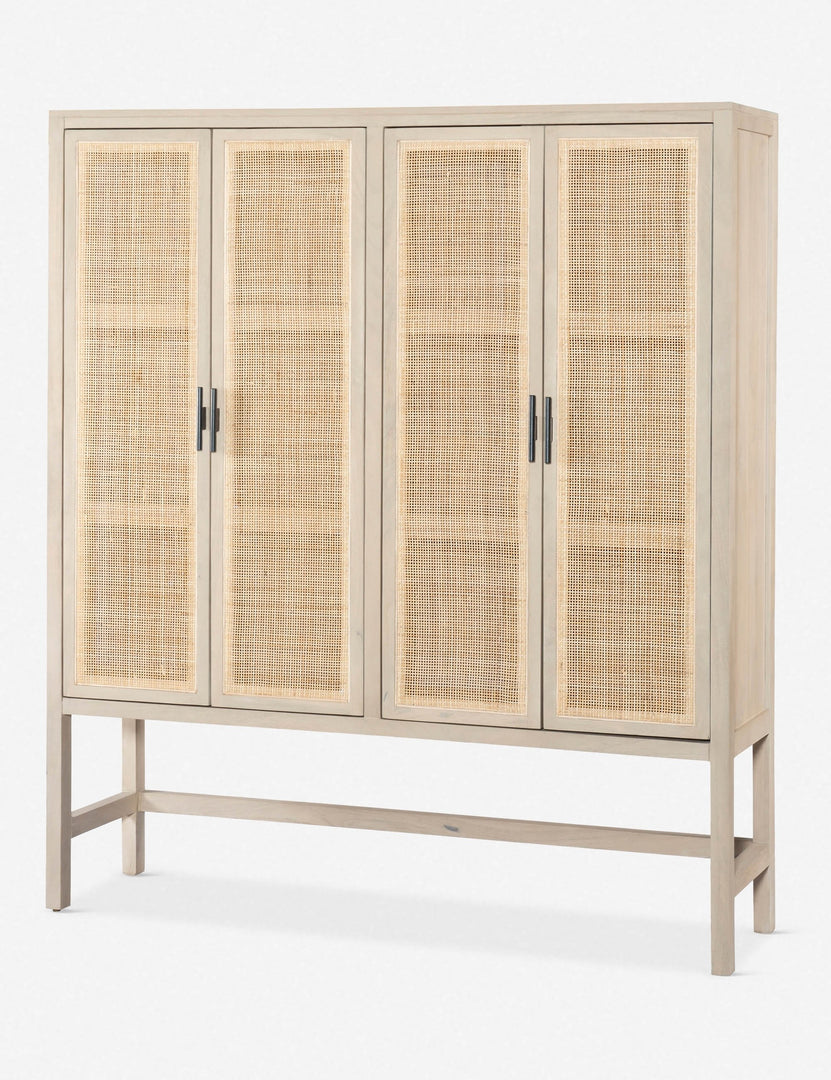 #color::natural | Angled view of the Hannah whitewashed mango wood cabinet with cane doors
