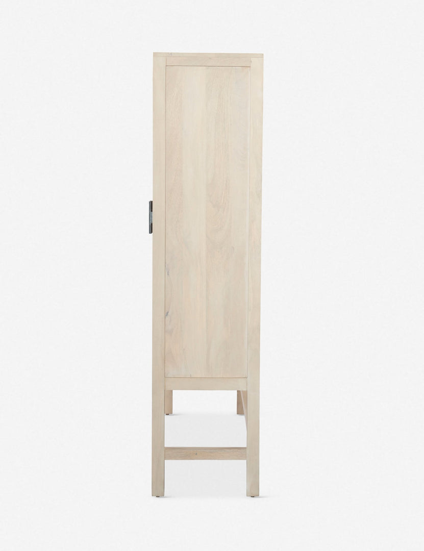 #color::natural | Side view of the Hannah whitewashed mango wood cabinet with cane doors