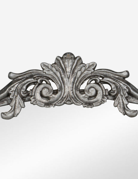 #color::silver | Detailed view of the traditional scroll detailing on the top of the Tulca arched silver mirror with flat bottom edge.