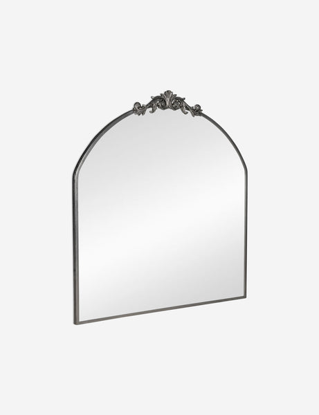 #color::silver | Angled view of the Tulca arched silver mirror with flat bottom edge and traditional scroll detailing.