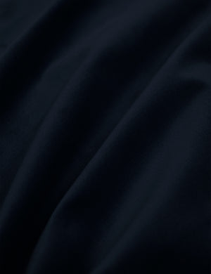 Close-up of the navy velvet fabric on the Clementine platform bed