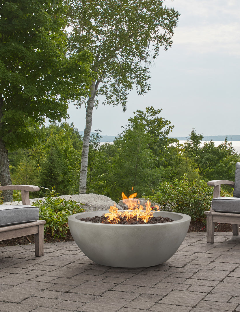 #color::shade #size::38- #configuration::propane | The Benno shade fire bowl sits in an outdoor space next to outdoor lounge furniture