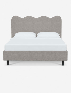 Clementine moonlight boucle platform bed with undulating lined headboard