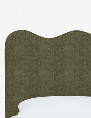 Close-up of the undulating lines on the headboard of the Clementine sage linen platform bed