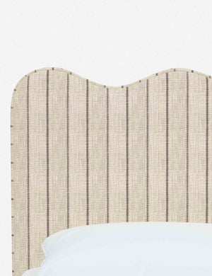 Close-up of the undulating lines on the headboard of the Clementine natural stripe linen platform bed