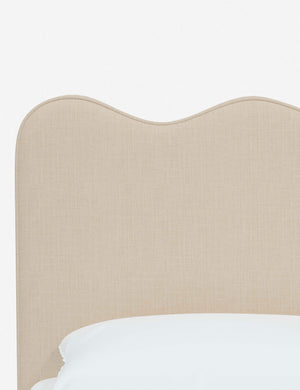 Close-up of the undulating lines on the headboard of the Clementine natural linen platform bed