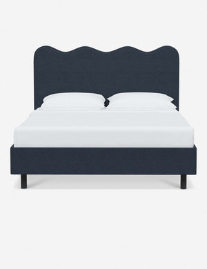 Clementine navy linen platform bed with undulating lined headboard