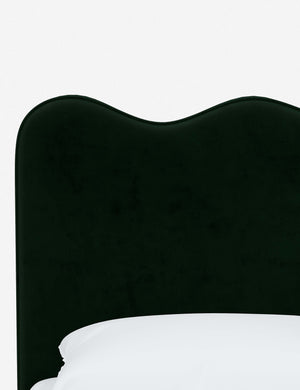 Close-up of the undulating lines on the headboard of the Clementine emerald velvet platform bed