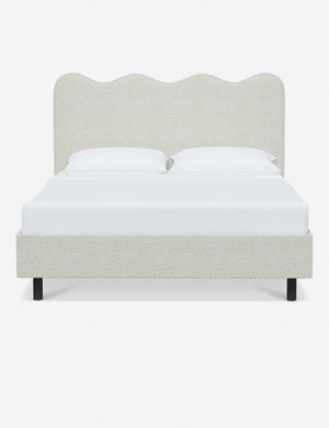 Clementine white boucle platform bed with undulating lined headboard