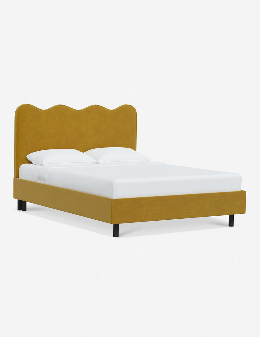 #color::citronella-velvet #size::twin #size::full #size::queen #size::king #size::cal-king | Angled view of Clementine yellow citronella velvet platform bed with undulating lined headboard
