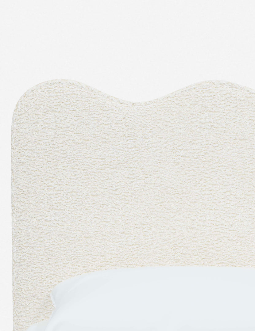 #color::cream-sherpa #size::twin #size::full #size::queen #size::king #size::cal-king | Close-up of the undulating lines on the headboard of the Clementine cream sherpa platform bed