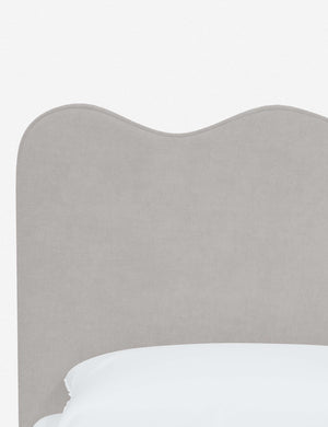 Close-up of the undulating lines on the headboard of the Clementine mineral velvet platform bed