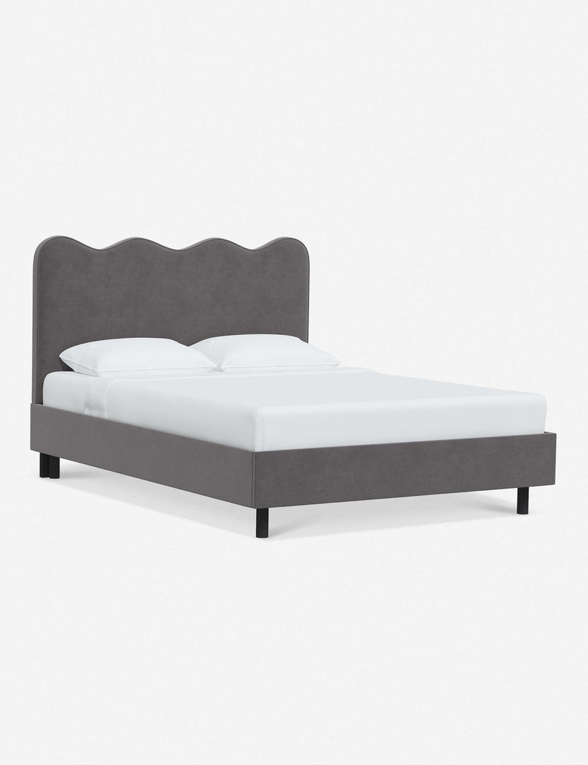 #color::steel-velvet #size::twin #size::full #size::queen #size::king #size::cal-king | Angled view of Clementine steel velvet platform bed with undulating lined headboard