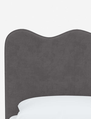 Close-up of the undulating lines on the headboard of the Clementine steel velvet platform bed