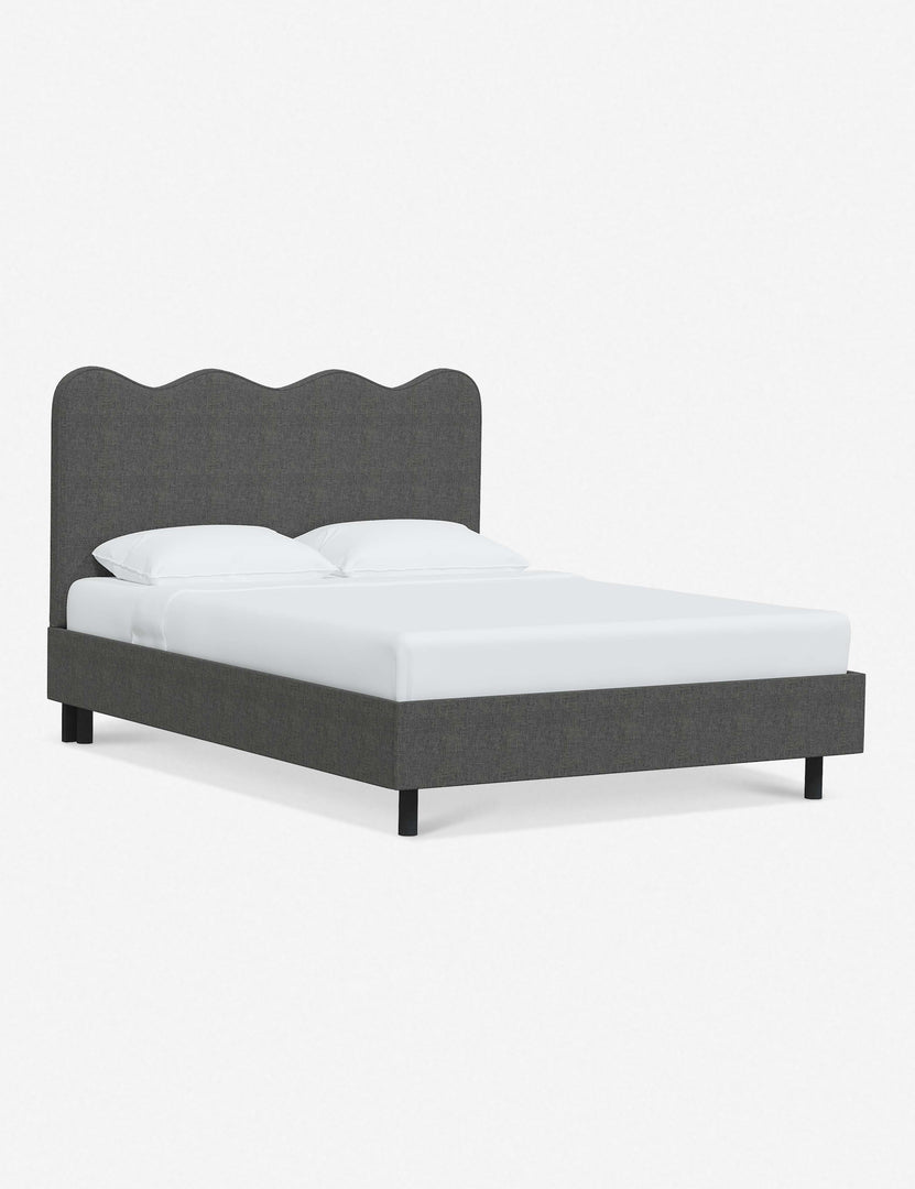 #color::charcoal-linen #size::twin #size::full #size::queen #size::king #size::cal-king | Angled view of Clementine charcoal linen platform bed with undulating lined headboard