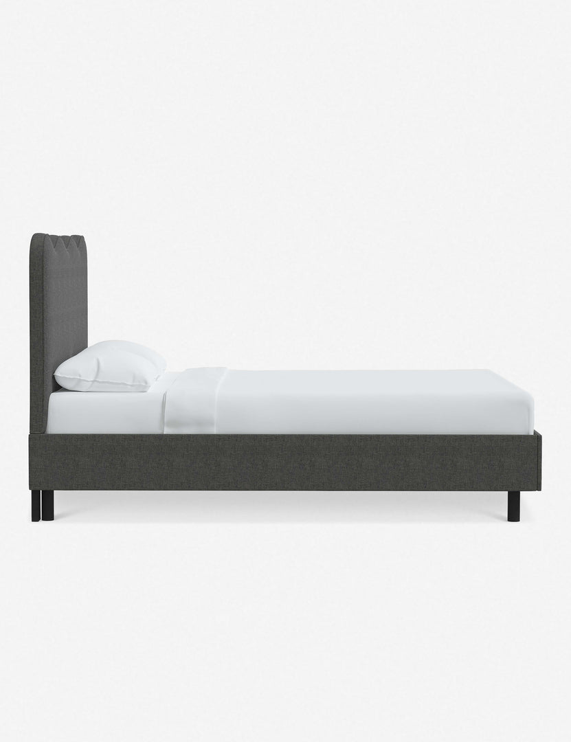#color::charcoal-linen #size::twin #size::full #size::queen #size::king #size::cal-king | Side view of Clementine charcoal linen platform bed with undulating lined headboard